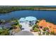 Expansive waterfront home on a point lot with manicured landscaping at 935 Chipaway Dr, Apollo Beach, FL 33572