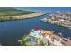 Waterfront home with lush landscaping, private dock, and stunning views of the bay and surrounding area at 935 Chipaway Dr, Apollo Beach, FL 33572