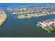 Gorgeous aerial view of waterfront home with private dock, Tampa Bay access, and lush landscaping at 935 Chipaway Dr, Apollo Beach, FL 33572
