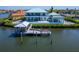 Spacious backyard with a private boat dock, outdoor seating, and well maintained landscaping at 935 Chipaway Dr, Apollo Beach, FL 33572