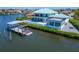 Beautiful backyard with private boat lift, well maintained lawn, and outdoor space at 935 Chipaway Dr, Apollo Beach, FL 33572