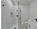 Bright bathroom features a glass shower, sleek countertops and white cabinets at 935 Chipaway Dr, Apollo Beach, FL 33572