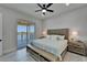 Bedroom with sliding glass door to private waterfront balcony at 935 Chipaway Dr, Apollo Beach, FL 33572