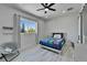 Bedroom with wood-look tile flooring and a large window at 935 Chipaway Dr, Apollo Beach, FL 33572