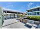 Well-maintained boat dock with covered lift and bench seating, connecting to a luxurious waterfront home at 935 Chipaway Dr, Apollo Beach, FL 33572