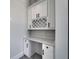 Stylish built-in desk and cabinet space with marble countertop and wine rack at 935 Chipaway Dr, Apollo Beach, FL 33572