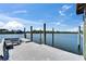 Spacious boat dock featuring sturdy wooden pilings, bench seating and room for water activities at 935 Chipaway Dr, Apollo Beach, FL 33572
