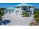 Beautifully landscaped two story waterfront property with a spacious three car garage at 935 Chipaway Dr, Apollo Beach, FL 33572