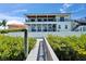 Stunning waterfront home with a private dock, spacious balcony, and lush landscaping with water access at 935 Chipaway Dr, Apollo Beach, FL 33572