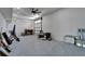 Spacious garage features epoxy flooring, overhead lighting, and an automatic garage door at 935 Chipaway Dr, Apollo Beach, FL 33572