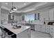 Spacious modern kitchen with marble countertops, a subway tile backsplash, and stainless steel appliances at 935 Chipaway Dr, Apollo Beach, FL 33572