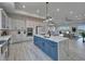 Spacious kitchen with large island, modern appliances, and open layout with views to the living and dining areas at 935 Chipaway Dr, Apollo Beach, FL 33572