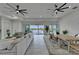 Open-concept living and dining area with waterfront view and stylish decor at 935 Chipaway Dr, Apollo Beach, FL 33572