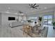 Comfortable living room and dining area with sliding glass doors leading to outdoor space and waterfront views at 935 Chipaway Dr, Apollo Beach, FL 33572