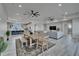 Spacious living area featuring a dining table, view into the kitchen, and neutral color palette at 935 Chipaway Dr, Apollo Beach, FL 33572