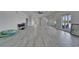 Expansive living area features light tile floors, high ceilings and natural light at 935 Chipaway Dr, Apollo Beach, FL 33572