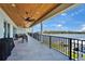 Spacious, covered outdoor patio offers stunning water views, ample seating, and a beautifully finished wood ceiling at 935 Chipaway Dr, Apollo Beach, FL 33572