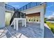 Spacious outdoor patio with stairs, featuring a waterfront view and an airy, open design perfect for entertaining at 935 Chipaway Dr, Apollo Beach, FL 33572