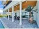 Outdoor patio with a dining area, ceiling fans, and waterfront views, perfect for al fresco dining and relaxation at 935 Chipaway Dr, Apollo Beach, FL 33572
