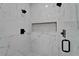 This shower features a tiled bench, multiple shower heads, and a clear glass door at 935 Chipaway Dr, Apollo Beach, FL 33572