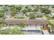 Aerial view of condominium complex with mature landscaping and covered parking at 9851 113Th St # 206, Seminole, FL 33772