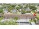 Aerial view of condo complex with mature landscaping and covered parking at 9851 113Th St # 206, Seminole, FL 33772