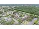 Expansive aerial view showcasing the community layout with mature trees, a pool, and ample parking at 9851 113Th St # 206, Seminole, FL 33772