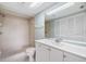 Bathroom with shower and a large vanity mirror and cabinet space at 9851 113Th St # 206, Seminole, FL 33772