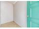Unfinished room with white concrete block walls and a door with gold hardware at 9851 113Th St # 206, Seminole, FL 33772