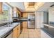 Charming kitchen with stainless steel appliances, tile flooring, and plenty of cabinet space at 9851 113Th St # 206, Seminole, FL 33772