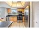 Bright kitchen with stainless appliances, plenty of counter space, and tile flooring at 9851 113Th St # 206, Seminole, FL 33772