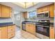 Well-lit kitchen featuring stainless steel appliances and tile flooring at 9851 113Th St # 206, Seminole, FL 33772