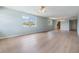 Spacious living room featuring light wood floors and natural light at 9851 113Th St # 206, Seminole, FL 33772
