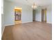 Open-concept living and dining areas with wood floors, lots of natural light and flow into the kitchen at 9851 113Th St # 206, Seminole, FL 33772