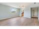 Inviting living room with modern flooring and a view into the kitchen at 9851 113Th St # 206, Seminole, FL 33772