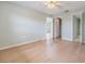 The bedroom features an ensuite bathroom, and wood floors at 9851 113Th St # 206, Seminole, FL 33772
