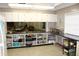Spacious community kitchen offers generous countertop and cabinet space with seating area at 9950 47Th N Ave # 311, St Petersburg, FL 33708