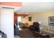 Comfortable living room featuring a dining table, leather recliner, and neutral-toned sofa at 9950 47Th N Ave # 311, St Petersburg, FL 33708