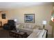 Cozy living room with comfortable seating, a glass coffee table, and a neutral color palette at 9950 47Th N Ave # 311, St Petersburg, FL 33708