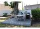Outdoor seating area with table, chairs, and grill, perfect for relaxing and grilling at 9950 47Th N Ave # 311, St Petersburg, FL 33708