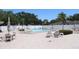 Inviting community pool with ample seating and well-maintained landscaping for residents at 9950 47Th N Ave # 311, St Petersburg, FL 33708