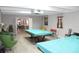 Recreation room featuring billiard tables, comfortable seating, and plenty of space for activities at 9950 47Th N Ave # 311, St Petersburg, FL 33708