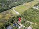 Aerial view of home with pool, surrounded by mature trees, in a serene, green neighborhood location at 10 Greenhaven Cir, Oldsmar, FL 34677