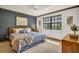A bedroom featuring a plush king bed and decor, creating a tranquil retreat for relaxation and rest at 10 Greenhaven Cir, Oldsmar, FL 34677