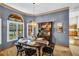 Formal dining room featuring a decorative chandelier and ample light at 10 Greenhaven Cir, Oldsmar, FL 34677