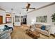 Open concept living room with a view to the front entrance at 10 Greenhaven Cir, Oldsmar, FL 34677
