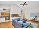 Comfortable living room featuring a vaulted ceiling and an open view into the kitchen at 10 Greenhaven Cir, Oldsmar, FL 34677