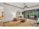 Bright living room with access to a screened in pool area at 10 Greenhaven Cir, Oldsmar, FL 34677
