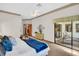Spacious main bedroom featuring a sliding door leading to the backyard patio at 10 Greenhaven Cir, Oldsmar, FL 34677