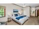 Bright main bedroom featuring an ocean-themed painting and lots of natural light at 10 Greenhaven Cir, Oldsmar, FL 34677